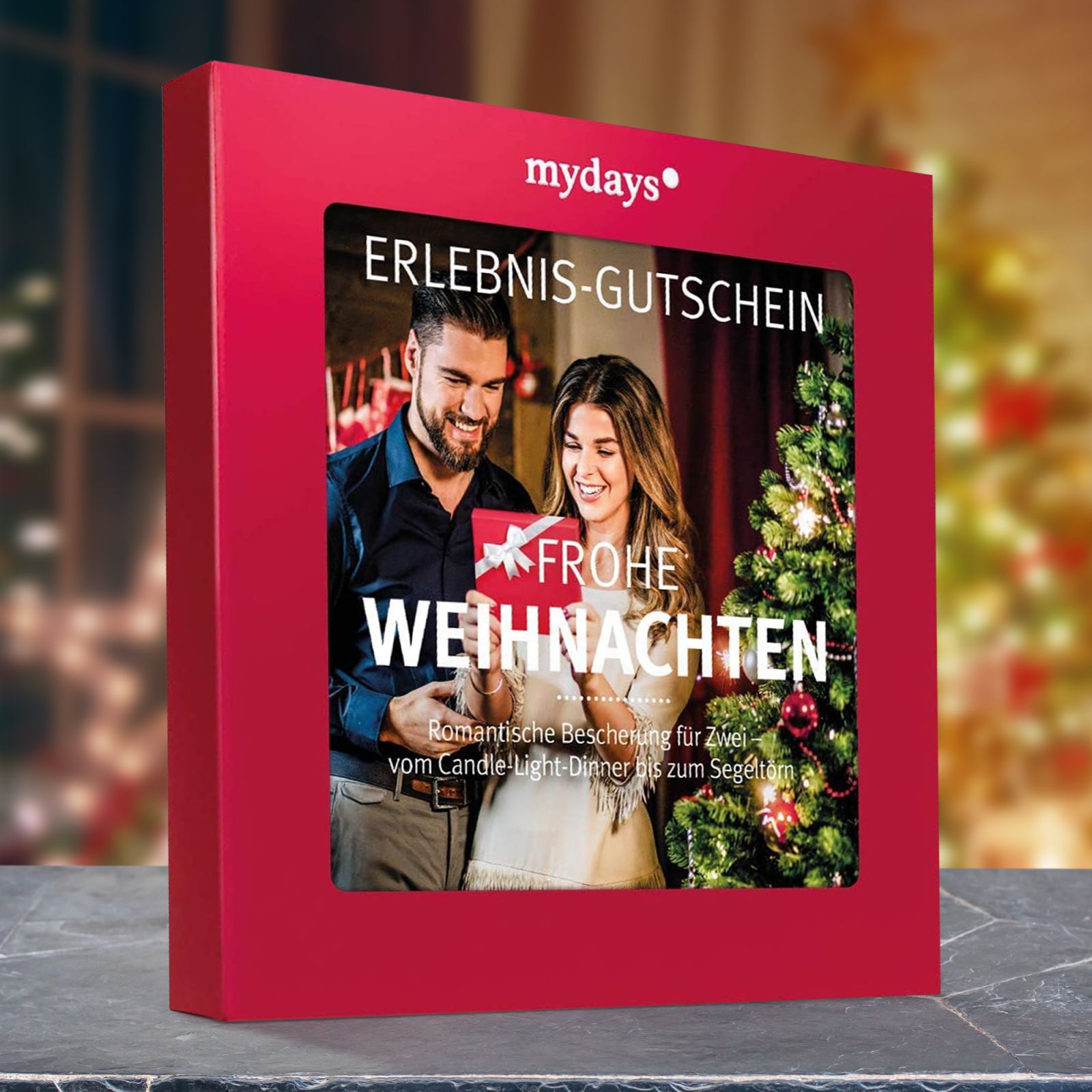 Erlebnisgutschein in roter Geschenkbox Frohe Weihnachten